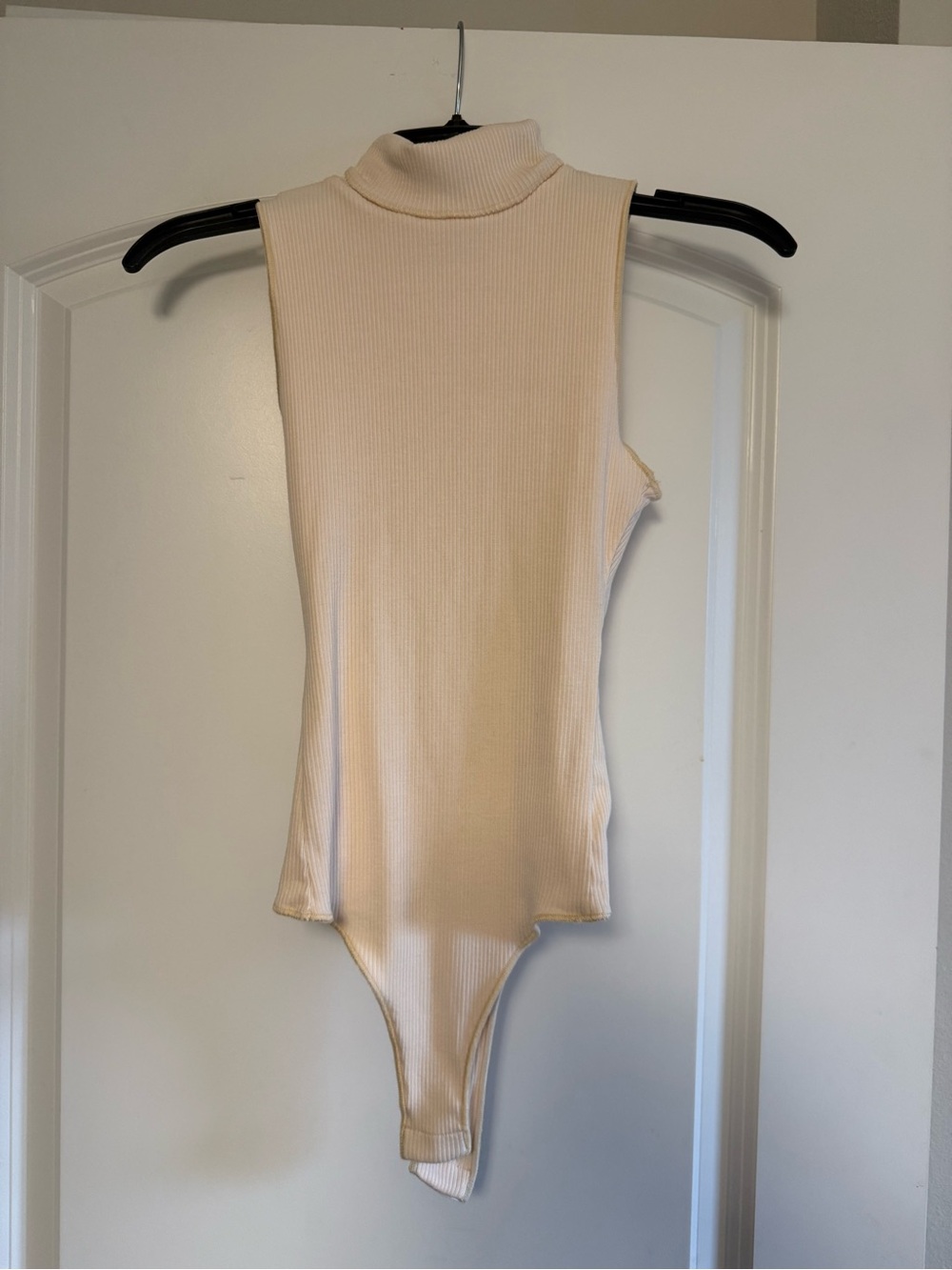 Show Me Your MuMu Cream Ribbed Sleeveless Turtleneck Bodysuit